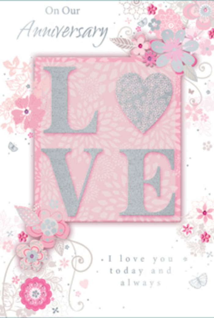 The image shows a beautifully crafted anniversary card that feels as tender and considered as a hand-tied bouquet. Across the centre, the word LOVE is printed in large, raised letters, their surfaces dusted with fine, frosted glitter that glows softly when it catches the light, much like sunlight slipping across fresh petals in a South Tottenham shop window. The letters are set on a subtly deeper blush-pink panel, which gives the impression of a layered card, adding a sense of depth and craftsmanship. Surrounding this central word, delicate, hand-drawn flowers and sweeping sprays of foliage float around the edges, framing the message without overwhelming it. The blooms are rendered in a mix of blush pink, lilac-tinged white, and pale silver-grey, each petal lightly shaded to suggest softness and movement. Some stems curl into elegant arcs, while fine filigree lines and tiny leaves trail outward, mimicking the gentle drape of greenery cascading from a vase. Hidden amongst the flourishes, small butterfly shapes and tiny petals appear almost as a quiet surprise, giving the design a whimsical, romantic touch. The background remains a soft, warm pink, creating a cocoon of colour that feels intimate and serene, like a cosy anniversary dinner at home near Philip Lane. In the lower portion, or tucked near the floral swirls, sits a message in graceful script-I love you today and always-its thin strokes echoing the lines of the illustrated stems. The entire card radiates a sense of enduring affection, carefully composed like a bouquet shared year after year.