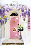 Outside a tucked-away home in South Tottenham, a doorway becomes a soft, floral invitation to step into a fresh chapter of life. The front door is painted a calming, pastel pink, its slightly chalky surface glowing gently against whitewashed walls and a pale shutter that both catch and reflect the diffused urban light. Above, wisteria drapes in loose, tumbling clusters of lavender blooms, forming a fragrant arch that feels almost theatrical, like a curtain rising on a new story. Each dangling strand of blossoms seems to brush the top of the frame, their cool purple tones contrasting subtly with the warmth of the pink door. On the step, set carefully at the threshold, a grey metal florist's bucket is filled to overflowing with creamy white roses. Their petals are full and cushioned, arranged so that a few blooms lean outward as if to greet anyone approaching from the pavements that thread around South Tottenham. Fresh green foliage peeks through the roses, adding structure and a hint of garden-like energy. Around the bucket's base is tied a soft pink ribbon, its satin bow trailing elegantly, tying together all the pastel notes like a finishing chord. The light is gentle, perhaps late afternoon, casting soft shadows that play across the stone and highlight the texture of the brick, petals, and leaves. The atmosphere is tender and uplifting, ideal for a housewarming moment-a quiet floral gesture that expresses joy, hope, and the reassurance that this new doorway, whether off West Green Road or near the bustle of Seven Sisters, is now truly home.